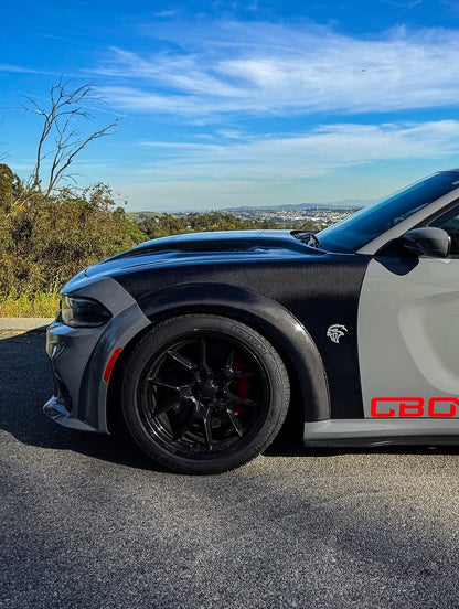 Black and gray sports car with Carbon Fiber fenders