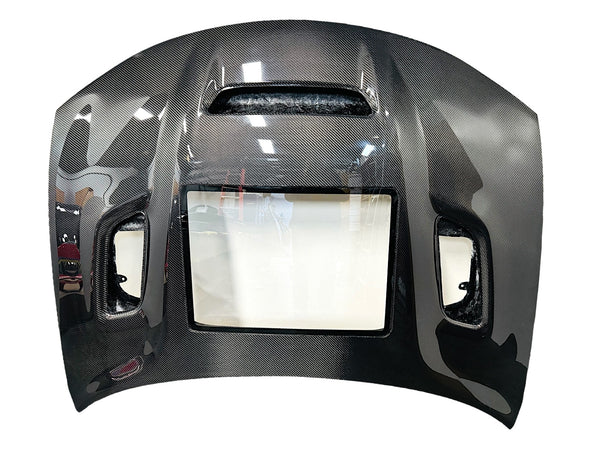 Carbon fiber hood for a Dodge Charger vehicle, featuring a glossy black finish and ventilation slots top view