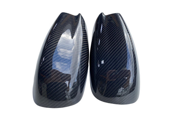 Top view of carbon fiber side mirror covers for 2015–2023 Dodge Charger and 2011–2023 Chrysler 300, featuring 2×2 twill weave pattern.